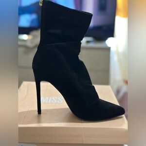 Selling black booties, size 8. Only worn once